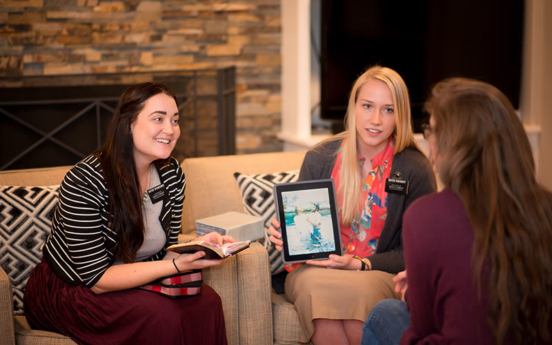 Sister missionaries teaching