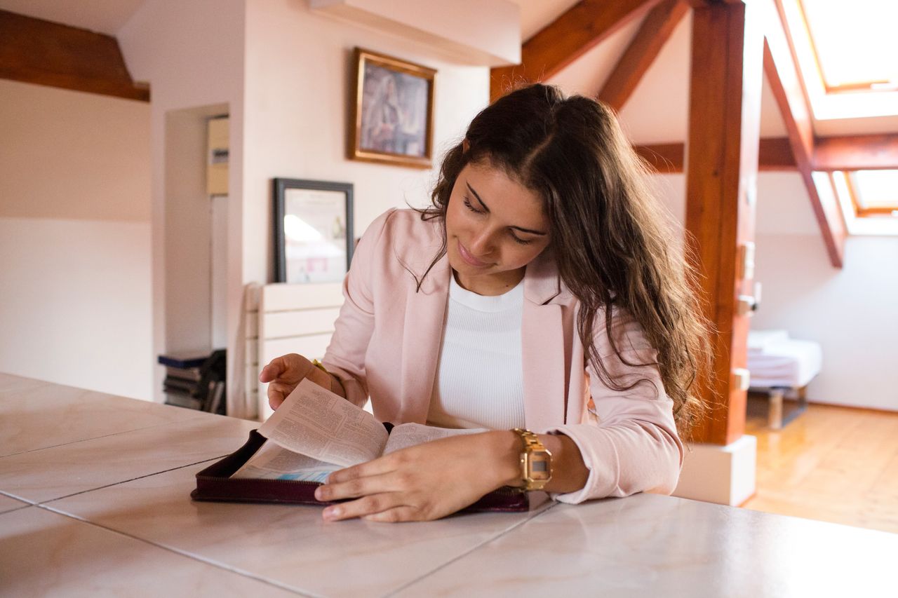 A woman reading the Book of Mormon